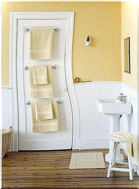 Put a hanger or towel rail on the bathroom door