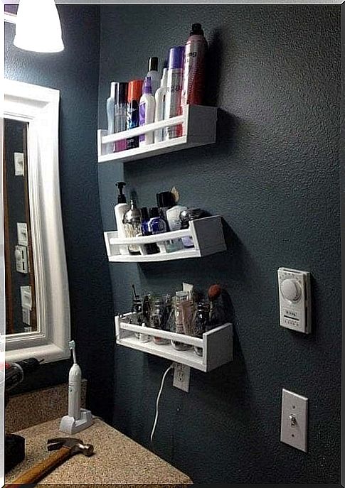 Wooden shelves offer a touch of elegance in the bathroom