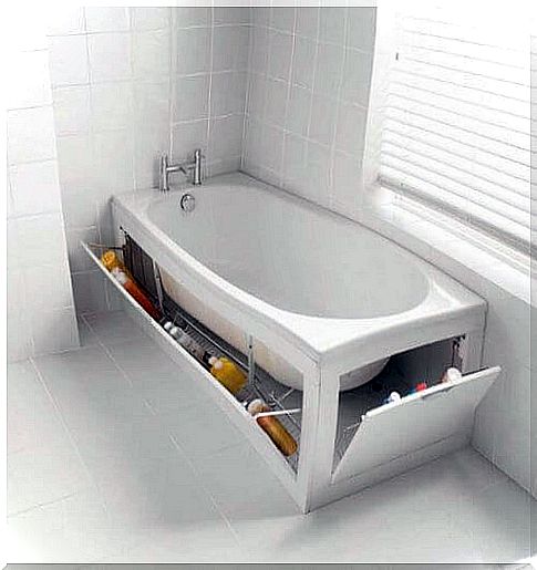 Creates a hidden storage space next to the bathtub in the bathroom