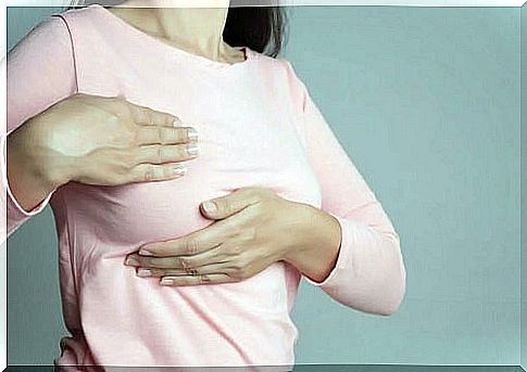 Woman experiencing breast pain after implant