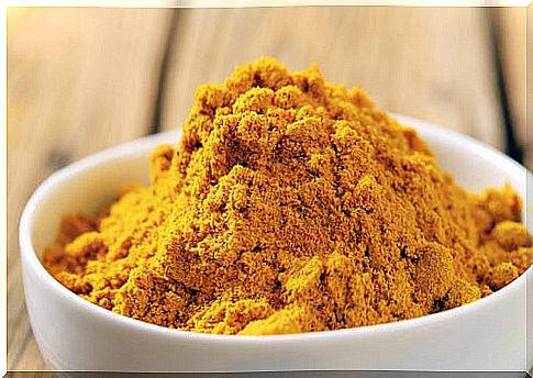 Bowl with turmeric powder