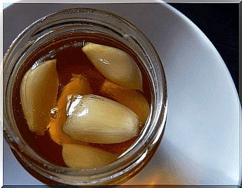 Natural remedy with ginger and garlic in a jar