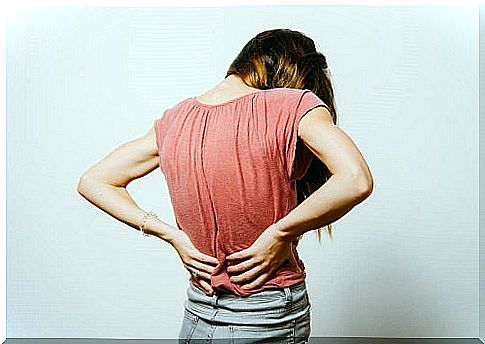 Woman discovering an ointment against low back pain