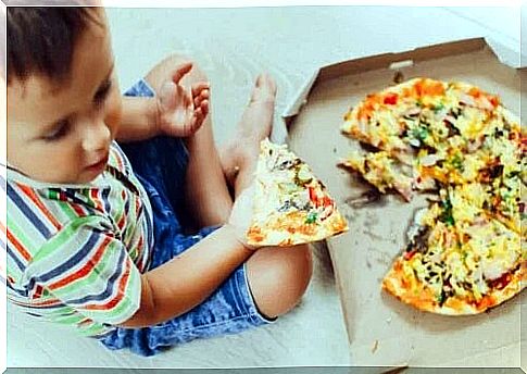 Child eating pizza