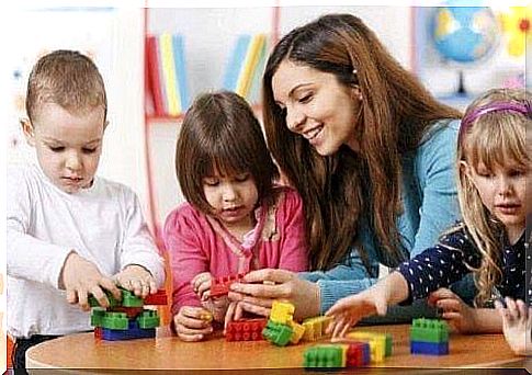 Children playing with the teacher